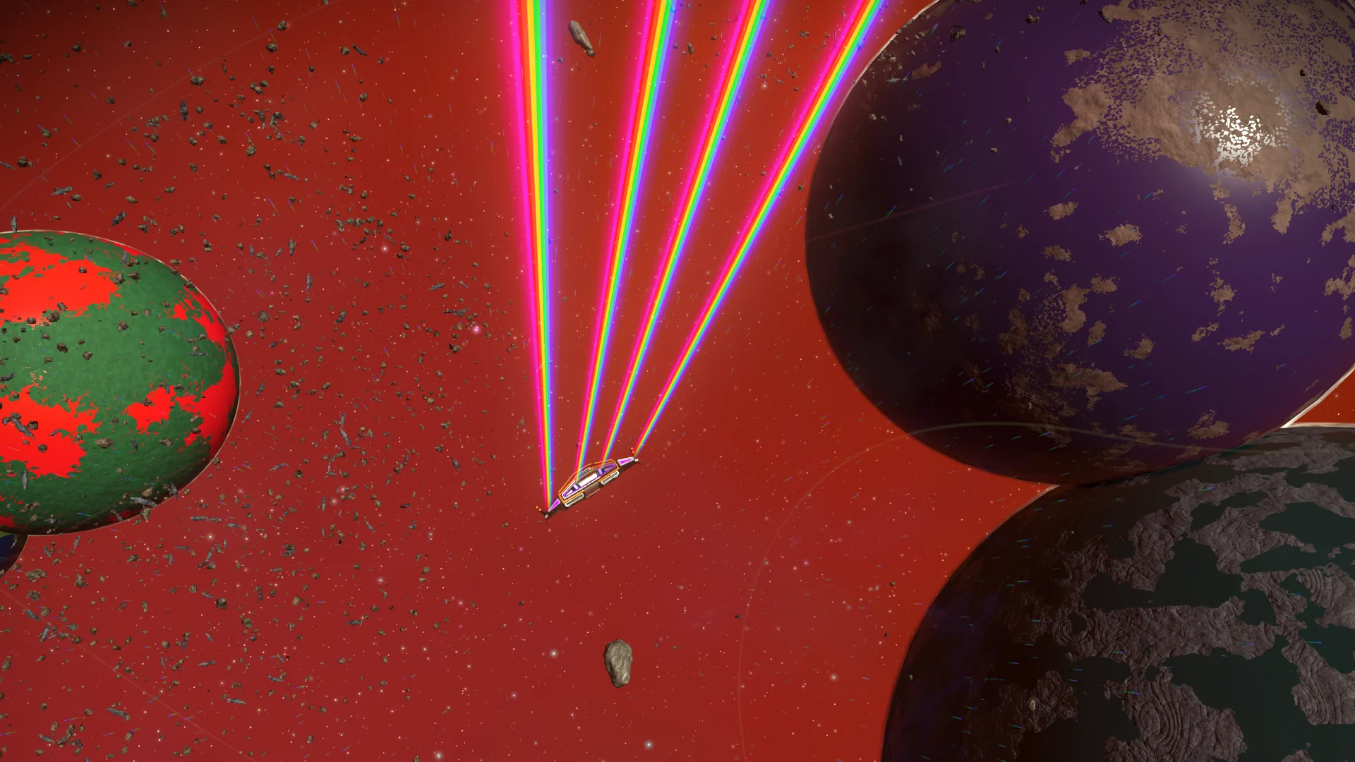 Multiple enormous worlds meeting against a red starfield